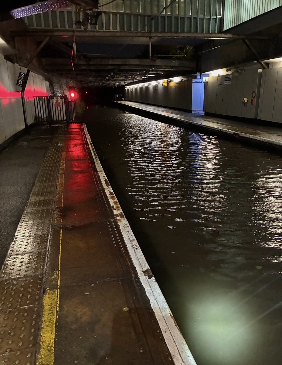 NetworkRailSCOT's tweet photo. 📸 These photos show just some of the damage #stormboelo has caused across Scotland’s railway, including flooding at Dalmarnock station, a flooded culvert at Craigendoran, fallen trees at Partick and damage to overhead wires at Bishopton. https://t.co/ktRX7WDMpG