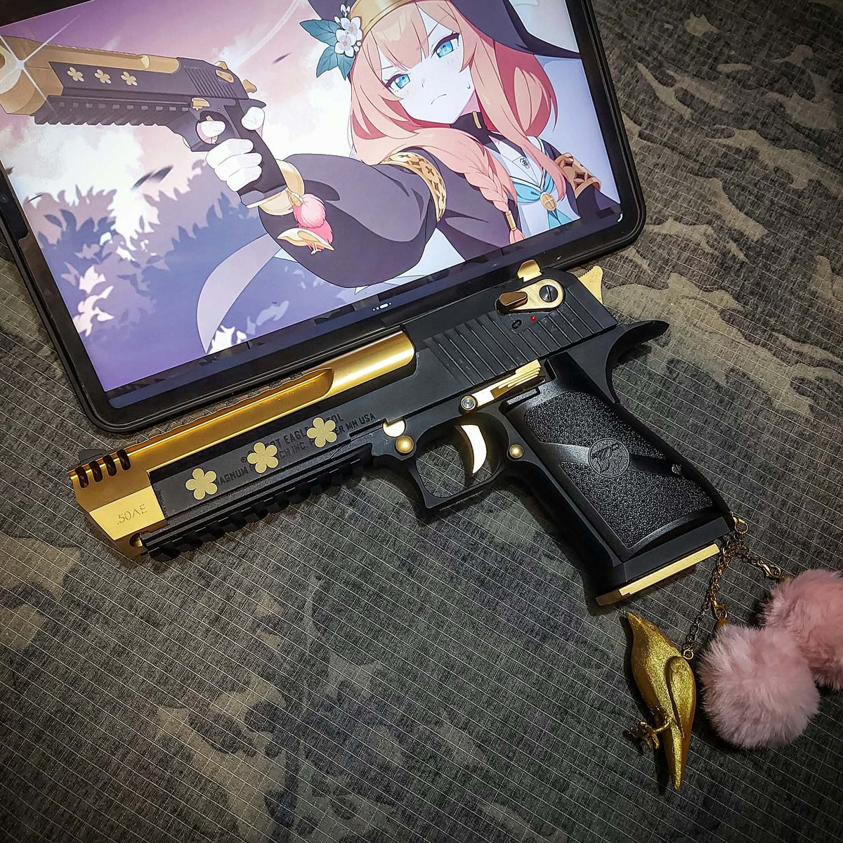 Mikhail_N762's tweet photo. My friend wanted Mari's gun, so he sent me a Desert Eagle to build. 😋 
It was a fun, straightforward project 
(Except for the fluffy ball and bird charm on the grip lol) https://t.co/fOa2pIuCRG
