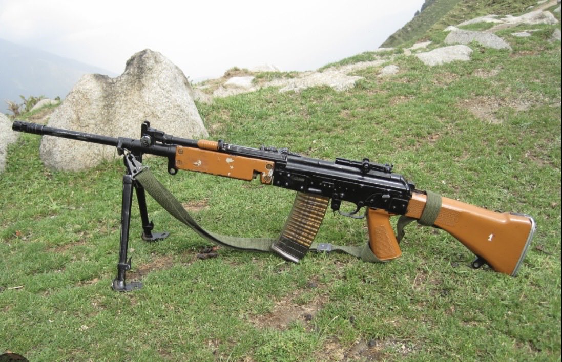 VintageWarfaree's tweet photo. The one picture sent to me from a military wiki page of the INSAS (Indian service rifle) and there’s poop under the gun. 

You can’t make this up https://t.co/nmTGak7KRj