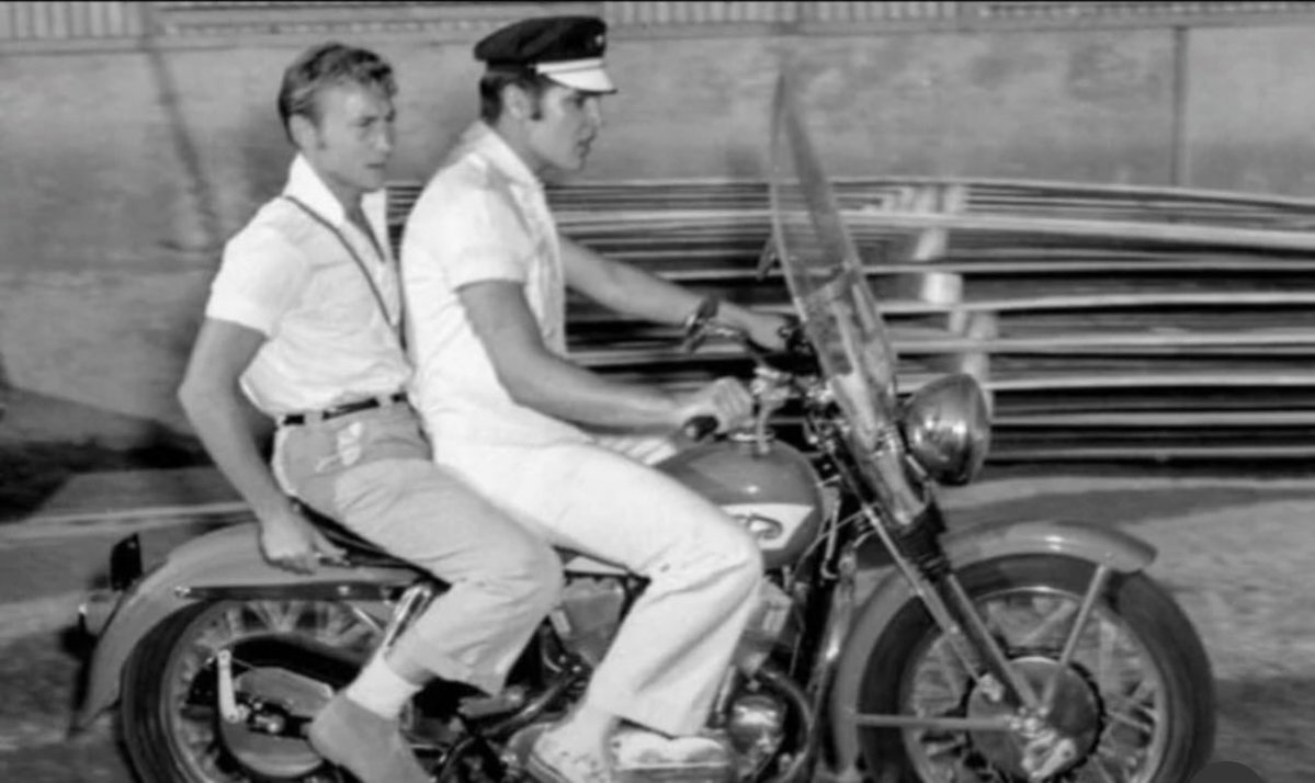 Visionaryvoid's tweet photo. In 1956, Elvis Presley had just exploded into stardom. He'd released his first No. 1 hit, appeared on national TV and moved to Hollywood to make his first movie, "Love Me Tender."

That's where he met Nick Adams, a young actor who had just appeared in "Rebel Without a Cause." Adams had also been a close friend of James Dean, who died in a car crash in 1955.
Adams quickly became part of Elvis's inner circle.

He spent time with him in Hollywood, traveled with him on tour and visited him at home in Memphis.
The two often rode motorcycles together.

Adams's own career kept growing. He starred in the TV Western "The Rebel" and earned an Academy Award nomination in 1964 for the courtroom drama "Twilight of Honor."

He passed away in 1968, at just 36.
Added fact: Elvis bought his first Harley-Davidson in 1956, the same year as this photo. Soon after, he appeared on the cover of the company's magazine, "The Enthusiast," sitting on his new bike.