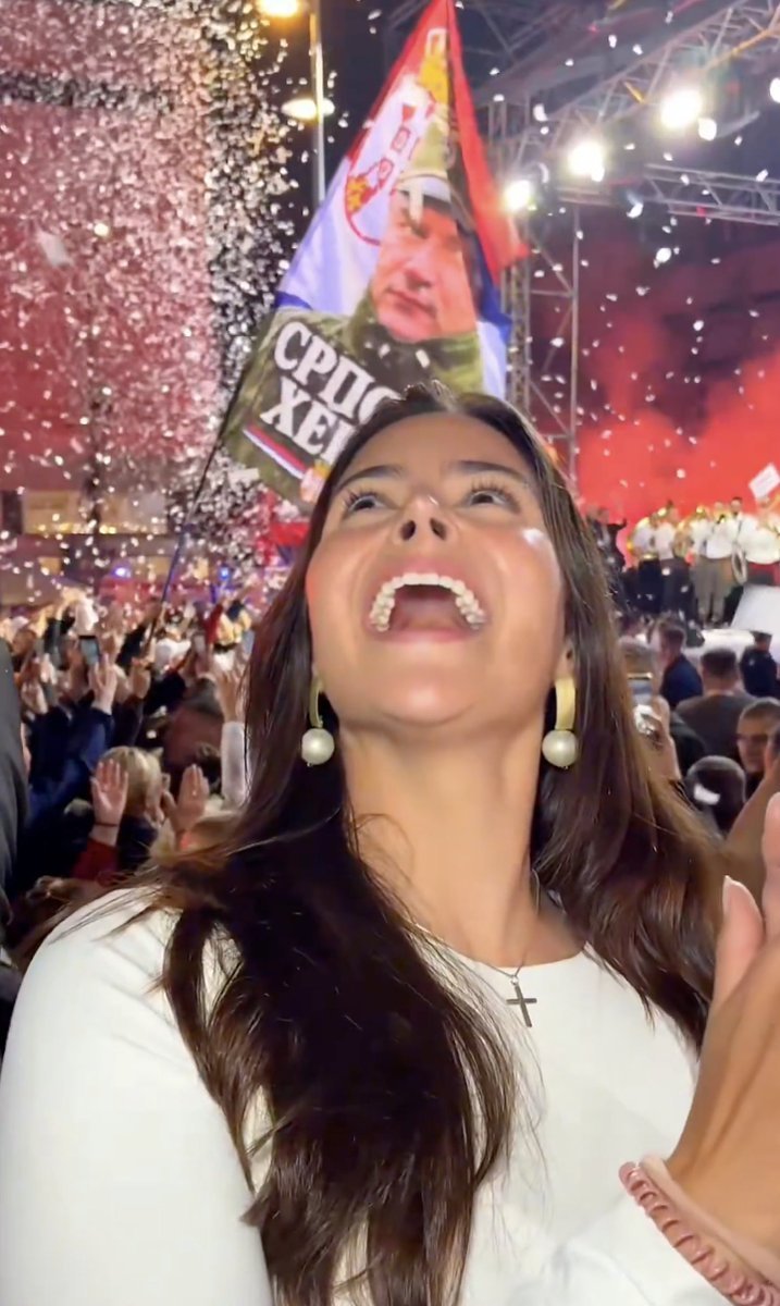 UkraineSol's tweet photo. American far-right influencer Valentina Gomez, who tried to come to the UK to speak for Tommy Robinson, has gone to Serbia to try to shore up Vučić, speaking in front of a Ratko Mladic banner and ending "Kosovo is Serbia"

Part of a plague of US rightwingers who have gone there https://t.co/s7UiorjYgC