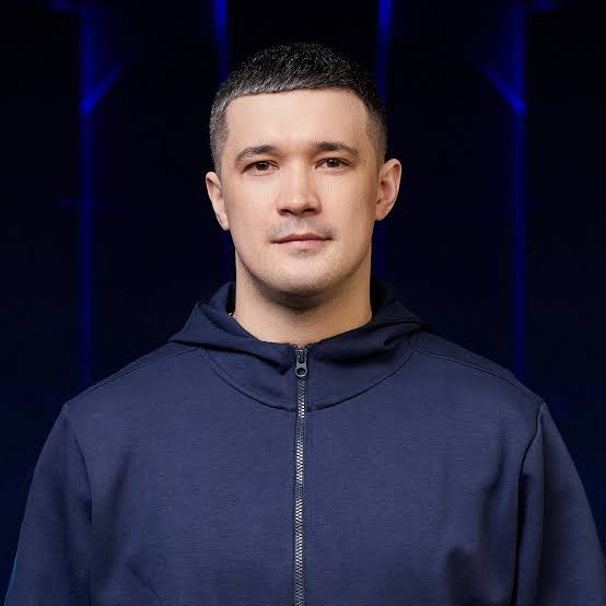 PakCryptOrg's tweet photo. MYKHAILO FEDOROV: THE DIGITAL STRATEGIST WHO HELPED TURN UKRAINE INTO A TECHNOLOGY-DRIVEN WAR MACHINE 🇺🇦💻

What happens when a digital marketer enters government, builds a national digital platform, mobilises hundreds of thousands of online participants during a war, helps secure satellite connectivity for an embattled military, and champions drones as a central instrument of warfare?

Meet Mykhailo Fedorov. 

Unlike a conventional military commander or intelligence officer, Fedorov's rise came through digital government, technology policy, and the mobilisation of civilian technical talent. Russia's full-scale invasion of Ukraine transformed those skills into instruments of national defence.

Here is the story—and what cybersecurity professionals, software engineers, and military technologists can learn from it.

1. WHO IS MYKHAILO FEDOROV?

Fedorov was born in 1991 in Vasylivka, in southern Ukraine. Before becoming internationally known, he worked in marketing and digital communications.

His political breakthrough came in 2019, when he helped run Volodymyr Zelenskyy's successful presidential social-media campaign.

After Zelenskyy's victory, Fedorov entered government as Minister of Digital Transformation. At the time, he was one of the youngest members of the cabinet.

His original mission was not to wage cyberwar. It was to modernise government, digitise public services, reduce bureaucracy, and make technology a practical part of everyday life.

Then February 2022 arrived.

The same digital capabilities that had been used to transform public administration became relevant to a much more urgent problem: how to keep a country connected, mobilise technical expertise, and sustain a technologically sophisticated defence under invasion.

https://t.co/leNdfWGi2t

2. DIiA: THE STATE IN A SMARTPHONE

Before examining the cyberwarfare story, it is worth understanding the digital-government project that established Fedorov's reputation.

Under his leadership, Ukraine developed Diia, a digital platform that allows citizens to access a range of government services through their smartphones.

Its purpose was to reduce dependence on paper documents, physical offices, and traditional administrative processes.

This is more significant than it may initially appear.

Digital government requires identity management, secure authentication, data integration, service availability, privacy protections, and resilient infrastructure. It also requires institutions to redesign their processes rather than simply put old paperwork on a screen.

A successful digital public-service platform becomes part of a country's critical infrastructure.

During a national emergency, the ability to communicate with citizens and maintain access to essential services becomes even more important.

Diia was not created as a military weapon. But it demonstrated an important principle: a population accustomed to using digital public services is already operating within a technology-enabled civic ecosystem.

3. FEBRUARY 26, 2022: THE BIRTH OF THE IT ARMY OF UKRAINE
Four days after Russia launched its full-scale invasion, Fedorov announced the creation of a volunteer IT Army.

His appeal was direct: Ukraine needed digital talent, and people with technical skills could contribute to the fight online.

The announcement linked volunteers to a Telegram channel where cyber-operation tasks were published.

The model was unusual.

Instead of relying exclusively on a small number of government cyber specialists, Ukraine opened a channel through which a much larger population of technically capable volunteers could participate in cyber operations.

The IT Army subsequently targeted Russian government websites, financial services, commercial organisations, and other online infrastructure.

Distributed denial-of-service attacks, or DDoS, became one of its principal methods. These attacks attempt to overwhelm a service with traffic, making it unavailable or difficult to access.

The initiative attracted enormous attention. According to research published by the Center for Strategic and International Studies (CSIS), its Telegram channel reached approximately 300,000 members by March 2022.

That figure needs careful interpretation: channel membership does not equal 300,000 active operators, and participation did not imply equal technical expertise.

Nevertheless, the initiative demonstrated how quickly a government-backed call for technical volunteers could attract international participation during a major conflict.

https://t.co/8ughUIIQNg

Independent analysis — CSIS:
https://t.co/4EaLIzQ68L

4. THE IT ARMY WAS NOT A MAGICAL ARMY OF ELITE HACKERS
This distinction matters, especially to cybersecurity professionals.

The IT Army's most visible activities were often DDoS attacks, not sophisticated cryptanalysis or the covert exploitation of previously unknown software vulnerabilities.
A DDoS attack can disrupt access to a website or online service. It does not necessarily compromise the underlying system, obtain privileged access, or extract confidential information.

Nor does an outage automatically establish the operational or strategic importance of an attack.

The IT Army's significance lies partly in its organisational model: a publicly coordinated volunteer ecosystem, with target selection and tools distributed through online channels.

Researchers have documented a mixture of denial-of-service attacks, defacement, doxing, and reported data leaks. They have also noted that the initiative's operations and relationships with Ukrainian state institutions are not always straightforward to assess from public information.

This raises difficult questions about effectiveness, attribution, civilian participation, escalation, and the legal status of cyber operations conducted by volunteers.

A technically honest assessment must acknowledge those questions.

Fedorov's contribution was not that he personally invented a new hacking technique. It was that he helped turn digital participation into an organised component of wartime mobilisation.

https://t.co/GrWnEGtOWP

5. STARLINK: CONNECTIVITY BECOMES A MILITARY CAPABILITY

One of Fedorov's most visible interventions came in the early days of the invasion, when he publicly appealed to Elon Musk to activate Starlink satellite internet service over Ukraine.

The request was answered, and Starlink terminals subsequently became widely used in Ukraine, including by military units.

Why was this important?
Modern military operations depend on communications for command and control, situational awareness, coordination, intelligence sharing, and the transmission of information from the battlefield.

Traditional communications infrastructure can be damaged, disrupted, or rendered inaccessible during war.

Satellite connectivity can provide an alternative path, although it is not invulnerable to jamming, interference, service restrictions, or physical disruption.

Starlink was not a system Fedorov designed, and he did not independently create its underlying technology. His role was in recognising an urgent operational need, making the request publicly, and helping secure access to a commercial technology that Ukraine could put to use.

That is a different kind of technical contribution: connecting an existing technology to an immediate national requirement at scale.

The episode also illustrates a broader dependency in modern warfare. A nation's military communications may rely partly on commercial infrastructure operated by a private company outside its direct control.

That creates questions about resilience, governance, continuity of service, and strategic autonomy.

https://t.co/leNdfWGi2t

6. THE ARMY OF DRONES: FROM TECHNOLOGY POLICY TO THE BATTLEFIELD

Fedorov also became a prominent advocate of Ukraine's Army of Drones initiative.

The programme sought to expand the country's capacity to acquire, produce, and operate unmanned aerial vehicles for military purposes.

Drones had already demonstrated their military value before 2022. The invasion accelerated their adoption and the pace of technological adaptation.

Small unmanned systems can support reconnaissance, surveillance, artillery correction, and attack missions. Their effectiveness depends on much more than the aircraft itself: operators, communications, sensors, software, navigation, training, logistics, and the ability to adapt under electronic warfare pressure all matter.
The result is a rapid technological competition.

As one side improves its drones, the other develops countermeasures. As communications links become vulnerable to jamming, designers explore alternative control methods, navigation systems, and levels of autonomy.

The drone is only one component of a much larger system.

Fedorov helped promote the institutional and financial mechanisms intended to expand Ukraine's drone ecosystem. This included the Army of Drones initiative and efforts to encourage domestic defence-technology development.

The achievement should not be confused with personally inventing the drones or independently directing their battlefield use. His role was in helping mobilise resources, policy, industry, and organisational attention around the technology.

7. BRAVE1: BUILDING A DEFENCE-TECHNOLOGY ECOSYSTEM

Another important development was Brave1, launched in 2023 as a Ukrainian defence-technology cluster.

The objective was to bring together defence institutions, technology developers, investors, and other participants to accelerate the development and deployment of military technologies.

This is an important shift from treating defence innovation as the exclusive responsibility of large, established contractors.

In a rapidly evolving conflict, smaller firms and engineering teams may be able to develop and adapt particular technologies quickly. But they need access to funding, testing, users, procurement pathways, and feedback from the field.

A functioning innovation ecosystem attempts to connect those pieces.
Ukraine's defence-tech activity has covered drones, electronic warfare, robotics, communications, and other capabilities. Brave1 has provided a mechanism for supporting and coordinating parts of that ecosystem.

The broader lesson is familiar to anyone working in engineering: innovation is not just the invention of a good product. It requires a system that can repeatedly move ideas from prototypes into real operational use.

The Ukrainian government has reported substantial growth in the number of companies and solutions associated with Brave1. Those figures are official programme statistics, not independent measurements of the battlefield effectiveness of every supported technology.

Ukraine's Ministry of Defence:
https://t.co/6TPjNBrNOA

8. THE DATA-DRIVEN BATTLEFIELD

Fedorov's technology agenda increasingly emphasised the collection and use of operational data.

One example was the development of incentive systems in which verified battlefield results could earn points redeemable for equipment.

The idea was to connect operational activity, digital records, and the allocation of resources.

Conceptually, this resembles a feedback loop:

Observe → Record → Verify → Analyse → Allocate → Improve.

Such systems can help decision-makers identify demand and channel resources. They can also create new risks.
Measurements are not the same as reality. Incentives may encourage people to optimise the metric rather than the mission. Video verification can be incomplete, and the availability of recorded evidence may differ between units or types of operation.

A data-driven military must therefore care about data quality, verification, security, incentives, and the consequences of its measurement system.

Collecting battlefield data is not inherently the same as understanding the battlefield.

The challenge is to turn data into better decisions without allowing the data itself to distort the behaviour being measured.

https://t.co/leNdfWGi2t

9. FROM DIGITAL TRANSFORMATION TO MINISTER OF DEFENCE

In January 2026, Ukraine's parliament appointed Fedorov as Minister of Defence.

This was a significant transition: the former digital-transformation minister was now responsible for a ministry dealing with the enormous human, operational, industrial, and organisational demands of a prolonged war.

His stated priorities included military reform, digitalisation, greater use of technology, and changes to the organisation and support of the armed forces.

His appointment reflected the importance Ukrainian leaders placed on technological adaptation and defence innovation.

But it also exposed the limits of a technology-centred approach.

Military effectiveness depends on trained personnel, logistics, leadership, force structure, procurement, morale, and the ability to sustain operations. Software and drones cannot independently resolve problems involving manpower, institutional trust, or command relationships.

Fedorov's tenure also involved disagreements over strategy and procurement, and criticism of aspects of his proposed reforms. Reuters reported that he was dismissed in July 2026, after roughly six months in the position.
His record should therefore be examined as a developing and contested chapter in Ukraine's military transformation—not as a story of unqualified success.

10. WHAT CAN CYBERSECURITY PROFESSIONALS LEARN FROM HIS STORY?

There are at least five lessons worth considering.

First: mobilisation is a capability.

A country may possess talented security researchers, software engineers, network specialists, and systems administrators without having a mechanism to coordinate them in a crisis.

Fedorov's IT Army initiative showed how digital channels could mobilise volunteers at extraordinary speed. It also exposed the governance and accountability problems that arise when civilian participation intersects with offensive cyber operations.

Second: technology matters when it solves an operational problem.

Starlink was valuable not because satellite internet was a new invention, but because connectivity was urgently needed. The relevant capability was the combination of technology, access, deployment, and operational adoption.

Third: resilience is more than cybersecurity.

A resilient digital state needs secure systems, reliable communications, alternative infrastructure, continuity planning, and the ability to continue operating under disruption.
Fourth: innovation requires institutions.

The Army of Drones and Brave1 illustrate attempts to connect engineers, funding, procurement, military users, and operational feedback. Innovation without deployment is just a prototype.

Fifth: data and automation need sound governance.

Digital systems can improve coordination and resource allocation, but they also introduce risks involving inaccurate data, misaligned incentives, privacy, security, and excessive confidence in metrics.

These lessons are relevant far beyond Ukraine.

They apply to national cyber defence, critical infrastructure, emergency response, military communications, and the development of secure digital public services.

****THE BIGGER PICTURE****

Mykhailo Fedorov did not become prominent because he broke a famous cipher or discovered a revolutionary vulnerability.

His story is about something different: the use of digital platforms, networks of people, commercial technology, and innovation institutions to expand a country's ability to respond to war.

His career also demonstrates that cyberwarfare is not synonymous with hacking.

The digital dimension of a conflict includes communications, government services, industrial innovation, intelligence support, software, satellite connectivity, unmanned systems, data, and the people who make those capabilities work together.

A cyber operation may take a website offline. A resilient digital ecosystem can help a country keep functioning under attack.

Those are different kinds of power.

And in a prolonged conflict, both can become part of the wider contest.

#CyberSecurity #CyberWarfare #Ukraine #DigitalTransformation #DefenceTech #ITArmy