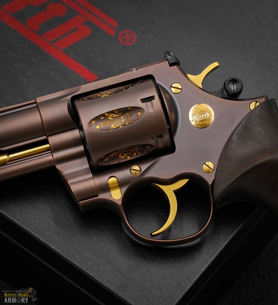 BattleHawkArmor's tweet photo. True elegance - the @NighthawkCustom + Korth Fleur De Lis. Walnut grips, bronze DLC, gold-finished fleur de lis motifs, and chambered in .357 Magnum. https://t.co/g2VrPuhjCV