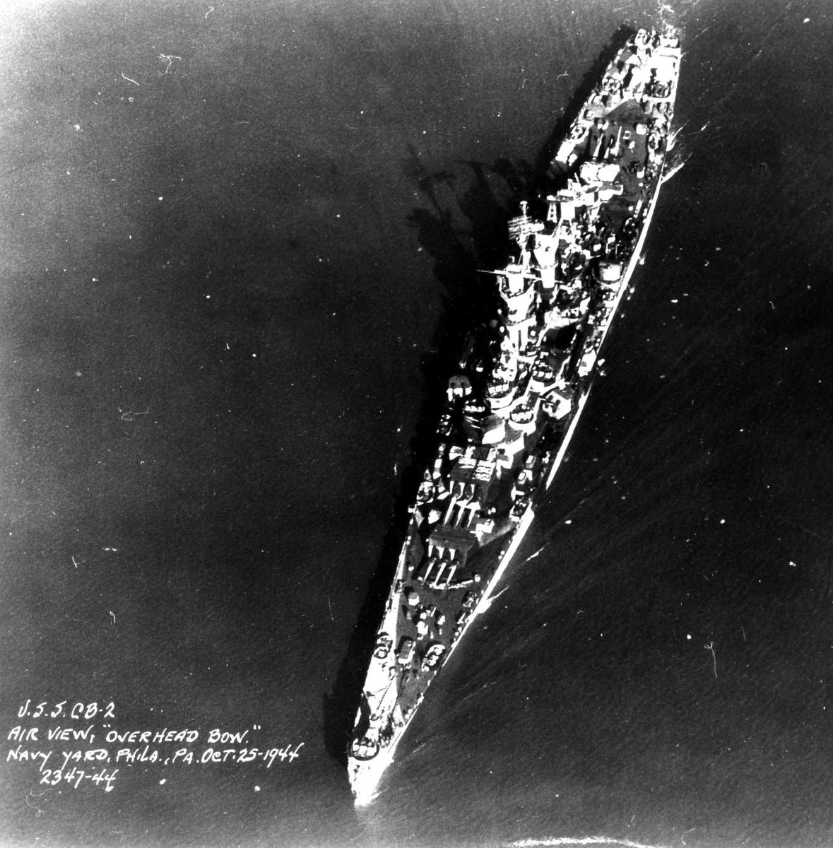 HiddenHistoryYT's tweet photo. Aerial view of large cruiser Guam, Philadelphia Navy Yard, Pennsylvania, United States, 25 October 1944 https://t.co/79amC4lJE1