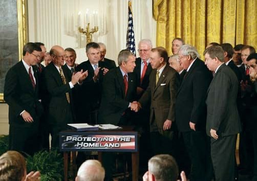 25YearsAgoLive's tweet photo. President Bush signs into law the Patriot Act, giving the United States government sweeping powers to spy on private citizens. https://t.co/Tk5XiAG091