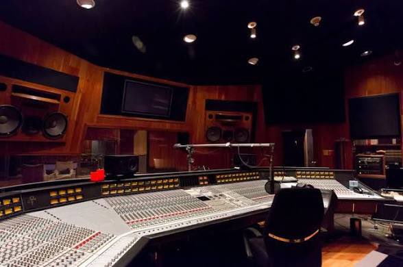 PrinceOnThisDay's tweet photo. On October 27, 2013, Prince tracked “The Gold Standard” at Paisley Park Studios in Chanhassen, Minnesota. The date comes from a photographed vault tape labeling the session at his private complex; the track later became the fourth song on his 2014 album Art Official Age. 

The Song and Its Place in Prince’s Catalog
“The Gold Standard” is a 5:53 percolating electro-funk number written by Prince and co-produced with Joshua Welton. Early descriptions called it “an update of classic Prince” whose lyrics nodded to the “wild and rude” of earlier eras while insisting on style over excess. 

The lyrics urge movement and release—“Shut your party down, make you walk around… let your body move”—while declaring that “nude is the brand new yawn” and that “you don’t need to be rude, you don’t need to be wild… no compromise and done with style.” Music is framed as spiritual medicine that can “take your troubles away and make somebody smile.” A bridge even includes the playful line “24 carrot hashtag, put your phone in your bag.” The groove sits in a high-energy, danceable pocket with tight rhythms, stacked harmonies, and the kind of guitar and synth interplay long associated with Prince’s Minneapolis sound, updated for a more contemporary electronic palette.

It received its first public mention in a June 23, 2014, Minneapolis Star Tribune piece by Jon Bream, where it was previewed as the potential opener of an then-untitled project that evolved into Art Official Age. The album itself was recorded at Paisley Park between roughly 2011 and 2014 (with the bulk of the material from late 2013 through summer 2014) and released on September 26–30, 2014, the same day as the companion Plectrumelectrum album with 3RDEYEGIRL. “The Gold Standard” was not a single and saw only occasional live airings of clips in 2015 sampler sets.

Context at Paisley Park in Fall 2013:
October 2013 was an active period at the Chanhassen complex. Prince had staged intimate, last-minute shows there earlier in the month—most notably a packed October 5 performance that combined 3RDEYEGIRL and the New Power Generation, running late into the night with hits, covers, and deep cuts for roughly 1,100–1,200 fans who paid a $50 “donation.” A pajama-themed late-night/early-morning show followed on October 19. Studio work continued in parallel.

Joshua Welton, then in his mid-20s and married to 3RDEYEGIRL drummer Hannah Ford Welton, had become a central collaborator. After initially supporting the band, he was given co-production credit on Art Official Age—the first time Prince shared a full co-producer credit on a studio album under his own name. Welton has described the process as collaborative: Prince would outline a desired feel, Welton would build tracks in one studio while Prince worked in another, and they refined together. The album’s credits also list engineers including Chris James, with strings arranged by Adi Yeshaya and additional contributions from 3RDEYEGIRL members (Donna Grantis on guitar, Hannah Ford on drums, Ida Nielsen on bass) plus horns and strings on various tracks.

Legacy of the Session:
The October 27 tracking date anchors one of the more forward-leaning tracks on a late-career album that critics often praised for its renewed energy and studio imagination. Art Official Age debuted at No. 5 on the Billboard 200 and topped the Top R&B/Hip-Hop Albums chart, marking a commercial and critical high point for Prince in the 2010s. “The Gold Standard” stands as a concise statement of his enduring priorities: groove as the gold standard, style over mere excess, and music as something that moves both body and spirit.

Paisley Park, the 65,000-square-foot complex Prince built in the mid-1980s and where he lived and worked for much of his later life, was the natural home for the session. After his death in 2016 it opened as a public museum, preserving the studios and vault that documented moments like this one.

#PrinceOnThisDay