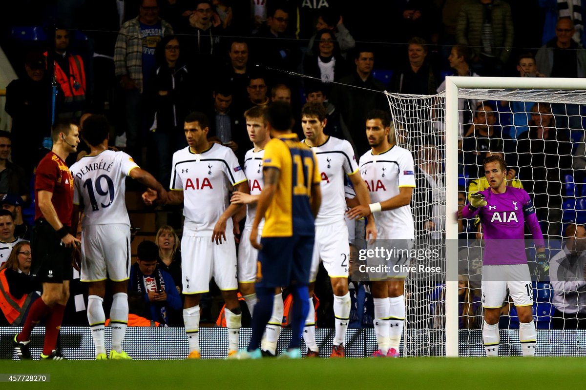SebC__'s tweet photo. When it comes to Harry Kane ; here's how I lived through the magnificent career that lead him to the most deserved Ballon d'Or 

In the early 2010s, I was familiar with him as I was watching England's youth teams across competitions (as well as Portugal, France and Netherlands). He wasn't the most highly rated of his generation, Conor Wickham and Saido Berahino definitely took the spotlight in the emerging talent scene.
Harry Kane was from the last generation before the Premier League's Elite Player Performance Plan (EPPP) implemented in 2012 ; when England was still crashing out in group stages of FIFA / UEFA Tournaments. He ended up captaining England supporting the entire new generation nurtured by Gareth Southgate and the extraordinary English FA developmental program in the 2010s.

I make no hiding from the fact that Pochettino is one of my childhood idols, as he was seeing out a career in France and looked so cool. So when he joined Southampton in 2013-14, that was also an opportunity to see he cut his hair, but also for me to keep an eye on his managerial career at Saints first then Spurs as I was on television every week for two years as a TV analyst. I took a special interest in fellow teenagers Lukaku, Barkley, Kane and Pogba's debuts in Premier League from the other side of the screen.

As a result, I routinely watched 7 Premier League games per week-end, was on TV the Tuesday and because imposter syndrome crept in, I felt compelled to watch the English team in Europa League on Thursdays. Another sacrifice which I never felt as such, because as I was also getting my coaching badges I learned so much from how Pochettino integrated the entire Tottenham academy. I vividly remember watching Harry Kane going in goal vs Asteras Tripolis FC in October 2014 and am pretty sure I tweeted a pixellated screenshot from whatever dodgy stream I was watching on, for my audience, only to probably get two likes and one retweet.

Harry Kane's debuts in the Football League were fairly unspectacular, and I learned a lot about the virtue of resilience and work. He couldn't get off the bench for Leicester City, but history will tell you he was competing with Jamie Vardy. He got off the bench for Norwich against Villas Boas' Chelsea at the Bridge when Mata scored his first goal on his debut, and had a chance from a long ball over the top, and took so long to get a shot off having eaten so much ground that my definitive conclusion was "you're never gonna make it at this level, son". Then I learned about his craft, how he never played as a striker at youth level but as a midfielder, and the benefits he eventually reaped from shooting thousands of footballs after training.

On TV, I was working with a former player turned leading pundit, Jean Luc Arribart who was close to Pochettino from his PSG days. From Pochettino's perspective, it's Harry Kane's goal at Villa Park that kickstarted the Poch's Spurs era, as the entire scope of journalists were keen to entertain the idea that he was merely a downgrade to Harry Redknapp. Tim Sherwood is adamant he veto-ed signing "Tottenham's big number 9" because he knew how good Kane would be. Truth might be somewhere alongst those lines. Amusingly, coming from a marmite character (Sherwood) ; then continued with Pochettino's mentorship : an Argie in the UK? Yes but he was also friends with Ossie Ardiles. What could a former no nonsense centre half tell us about coaching strikers with A2 English (and a translator at Southampton). Word was that Levy asked Poch to speak English - which he could, he just didn't want his words to be twisted.

Pochettino platformed Tottenham to two title races with a team of 23 years average, scorig 80+ goals and conceding 25 goals, pressing all over the pitch in traditional 442. About 20% of England's debuts were players also given a pathway by Pochettino.
Spurs actually finished 3rd in 2016 behind Arsenal. In collective memory, it clouds the 2017 season where Spurs made 86 points - only beaten by Conte's Chelsea making 93 points and 30 wins. Harry Kane scored a lot of goals. He scored 29 goals in 29 games in 2016-17 then 30 goals the season after. 
As the Poch chapter closed after Spurs amazingly went over a year without any signing, Mourinho came in and to an extent revived Kane's early career meanderings as a playmaker behind Son to make abundantly clear Kane was the most rounded attacker of his generation. I naturally watched every game

Life goes with high and lows, and I found myself in the non enviable situation of running out my dream job contract at home : since the welfare state was paying my wages, yet I couldn't work just like millions in many industries because oh right let's lock the country down for shits and giggles (a virus they said, or to hijack social unrest, we'll get to the bottom of it one day but we likely won't get reparation for the social ransacking). 

I didn't plan to return home, but like many millenials (born between 1981 and 1996), we found out through social media that there's no stigma to it. The industry is just utterly fucked up enough in so many corners that many of our and Kane's generation will end up with a backwards transitional step (unless : your parents bankroll you, or you're part of the problem. Kane - released by Arsenal, wasn't a nepo-baby either and went through rejection to finally find a way).

My dad always loved football, there's nothing more profound than the way your own dad shares what football means to him. For some, it's a social class warfare on a green rectangle, for others it's the feeling of belonging to a fanbase, but maybe also cherishing players "doing things the right way". Every generation is due to get annoyed at the current one, and lang for the one before. The compressed scheduling meant there was a game every evening in 2021. I wish to everyone to embrace the opportunity life might once throw at you unexpectedly, to reconnect with your parents during adulthood, as we now had an opportunity to watch football together but also explore what it meant to work hard when no one expects you to be there anyway, and how it might look down the road.

I never cut ties, I was just busy 24/7 and even now I couldn't comprehend how many projects I led at the same time for about a decade until COVID. On the TV programme, we watched many teams. Lampard's Chelsea, but also Mourinho's Spurs (and also Michael Olise's Reading). As we discussed the excesses and incomprehensible ways the football industry somewhat lives by (for anyone working, but not inside it, nothing makes sense. Nothing in the normal world applies. Why is it addictive to that extent), it appeared that Harry Kane was somewhat navigating through it : scoring goals, getting by, without ruffling feathers in what would represent an extraordinary throwback to an era of football that might never have been but that's not even the point.

My dad is all about Pelé's effort that licked the crossbar vs URSS, Brazil's 1970, witnessing Michel Platini's Nancy drawing 0-0 from the terraces, AS Saint Etienne's European exploits in 1976, Zinédine Zidane, the stadium lights by the window of his appartment as a child. And the scrapbooks from my progress into football. 
Also the big great disgrace that is the France-RFA 1986 semi final and Schumacher's assault on Battiston, with no anger but merely contempt as something that wasn't right. 
It's a special feeling to succeed at reconnecting generations, and Harry Kane arguably achieved that feat whilst doing what he does best : scoring goals. My dad got bored of the ceremony tonight (by the way, if you have any doubts about Thierry Henry, ask for an autograph or selfie and see if you're still on the fence), and untimely switched off before the announcement. I ended up once again, introducing him to Ballon d'Or winner Harry Kane by doing the announcement myself. 

You never know what the future is about, but if you put the effort to think about how you can make the most of every situation in life, you might end up influencing memories for more than a generation.

The other thing I share with Harry Kane is to be nominated somewhere at the London Palladium. 
He, however, won the big prize 🥇