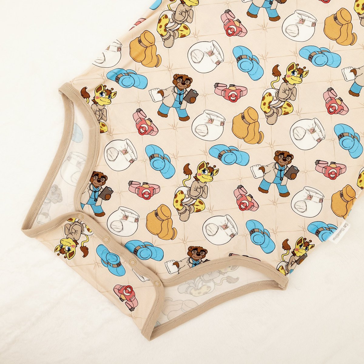LilComforts's tweet photo. Introducing our new Diapered Bondage Onesie! 

Uh oh! Looks like Finn is upping his “commitment” to all things padded! This bamboo onesie features art by @room_padded depicting a certain giraffe enjoying a little straitjacket time surrounded by padded walls, mittens, booties, as well as pacifiers that look awfully difficult to spit out. Our onesie is a lot easier to take off than a straight jacket, but it’s so comfy you probably won’t want to!

Now Available: https://t.co/9LFkILI8H5
