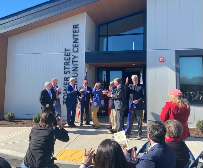 Senator Whitehouse and others cut a ribbon commemorating the grand opening of the Tower Street Community Center.