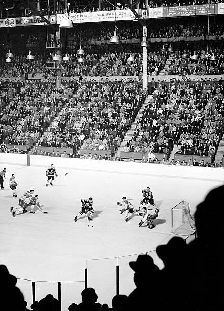 JoeHockeyPics's tweet photo. The original black and white version of S.I. photographer Hy Peskin's beautiful pic showing an aerial view of a game between the Bruins and Canadiens. According to the photo credit, this is from a game played on November 6, 1955. #NHLBruins #GoHabsGo 
📸: Hy Peskin/Getty Images https://t.co/wkiUeyZDbp