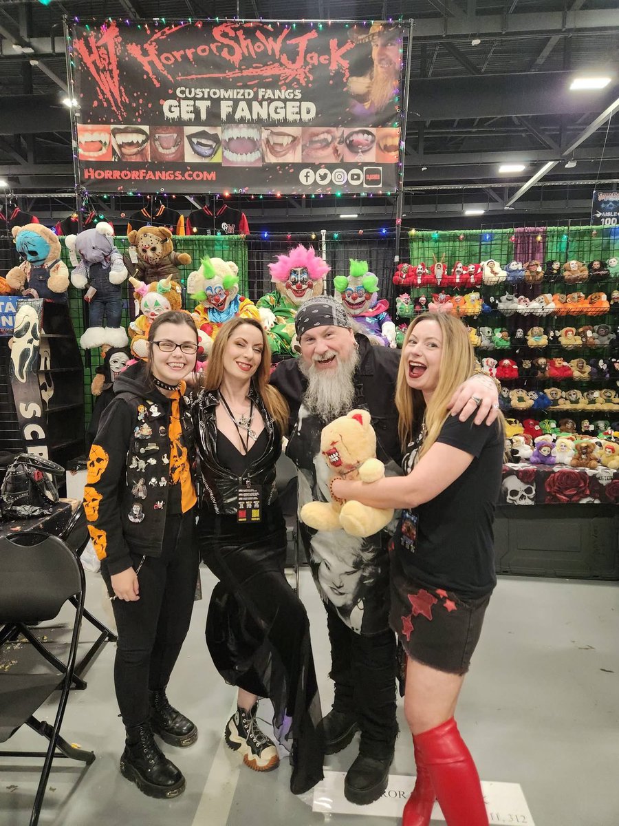 twisted_twins's tweet photo. If you want the TOP QUALITY BEST FANGS IN THE BUSINESS, look no farther. We’ve been FANGED by @horrorshowjack & we still have the afterglow. Him & Lydia are such a beautiful cool couple. If you see them at a horror near you, TREAT YO’SELF. Plus their horror plushies are to die for!!