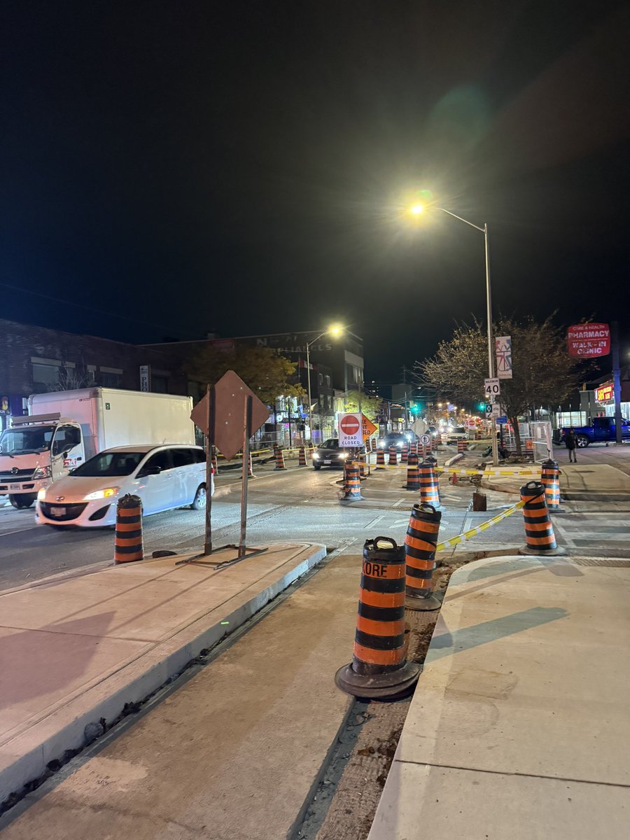 redvineski's tweet photo. Haven’t seen anyone mention it but tonight I noticed bike lanes are being installed along the Danforth near Main and Victoria Park. They look great and permanent with a large cement curb. Very similar strip to what’s being removed by Doug Ford near Royal York. https://t.co/0HIAULqn4A