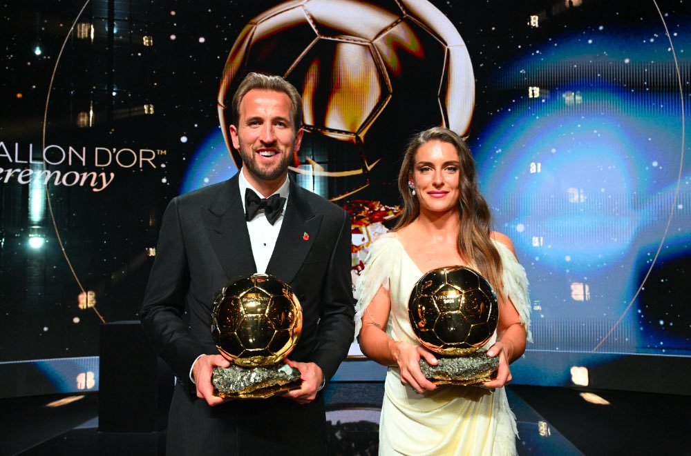 CliveKyazze's tweet photo. Harry Kane ends England’s 25-year wait as Alexia Putellas adds another Ballon d’Or to her collection.

Full report and all the winners 👇🏽

https://t.co/fvWd2QeAjB

#CKSports #BallonDor #BallonDor2026 https://t.co/QapCQsLzH2