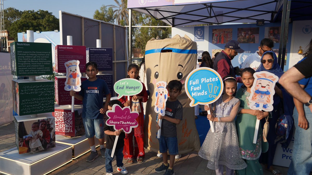 WFPPakistan's tweet photo. What a day, Karachi!🩵UN Day brought people  together for a celebration of learning, laughter and hope. At the WFP stall, visitors shared messages for schoolchildren, took on fun challenges, and explored how our work is building brighter futures across Pakistan https://t.co/kUmg9OTuMs