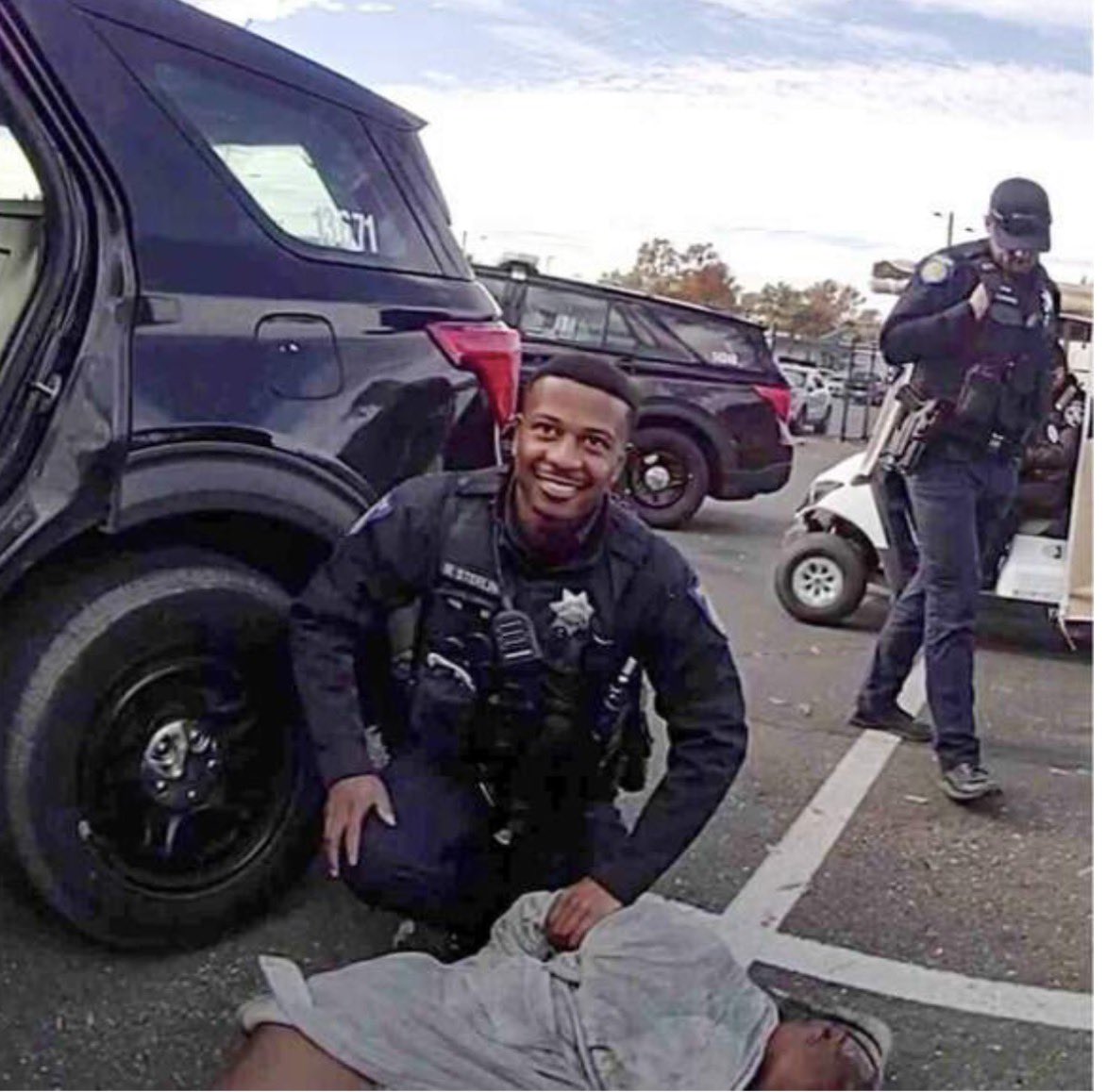 captivatedbyBlk's tweet photo. 🔴Lawsuit photos show California officer smiling over a handcuffed woman, 66, who later died

🔺A lot of Black cops strive to be accepted by white cops and would d anything to prove themselves like good little boys and girls expecting a treat https://t.co/5m1XDyle09