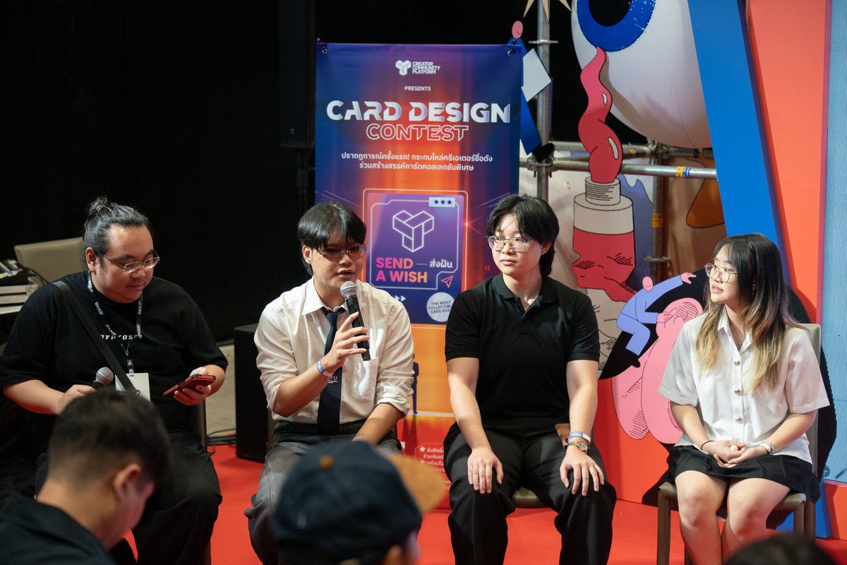 HeyNat's tweet photo. 📍 TCG cards are a tool for empowering Thai creators

I want Thai card collectors to see what Thailand Post is pushing for through CCP by ThaiPost. Bringing Thai artists in to create card art helps grow their market and reach new fans among collectors, and we hope it brings Thai creators more income and a bigger fan base.

My role is to bring CCP by ThaiPost to universities across Thailand to teach students. We recently visited Bangkok University, and next we're heading to Sripatum University (SPU). The goal is to get students competing, winning prizes, and building their portfolios before they enter the Thai job market after graduation.