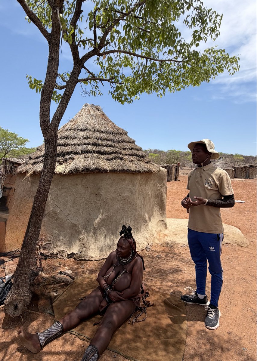 MunchPudding's tweet photo. #PostcardFromHimbaVillage On the way to Etosha, Mum’s group stopped at Himba Village to see how the Himba tribe live. First they visited the school, then met one of the ladies  🇳🇦 https://t.co/B1YmBlvWyi