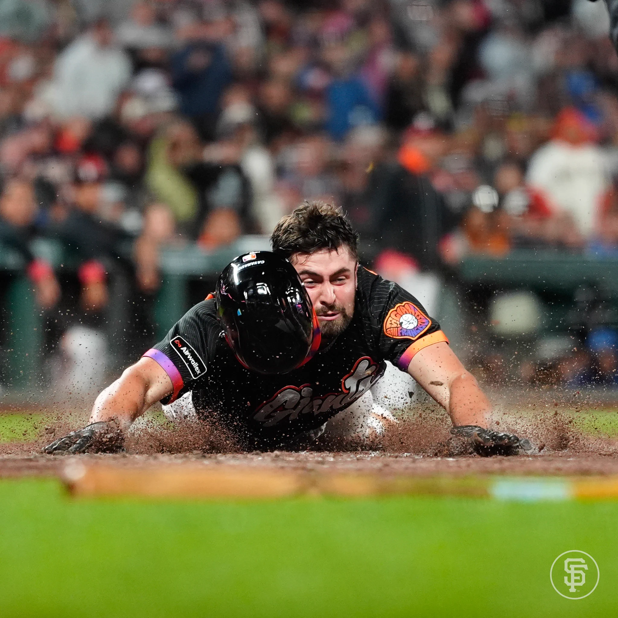 Drew Cavanaugh sliding at home plate