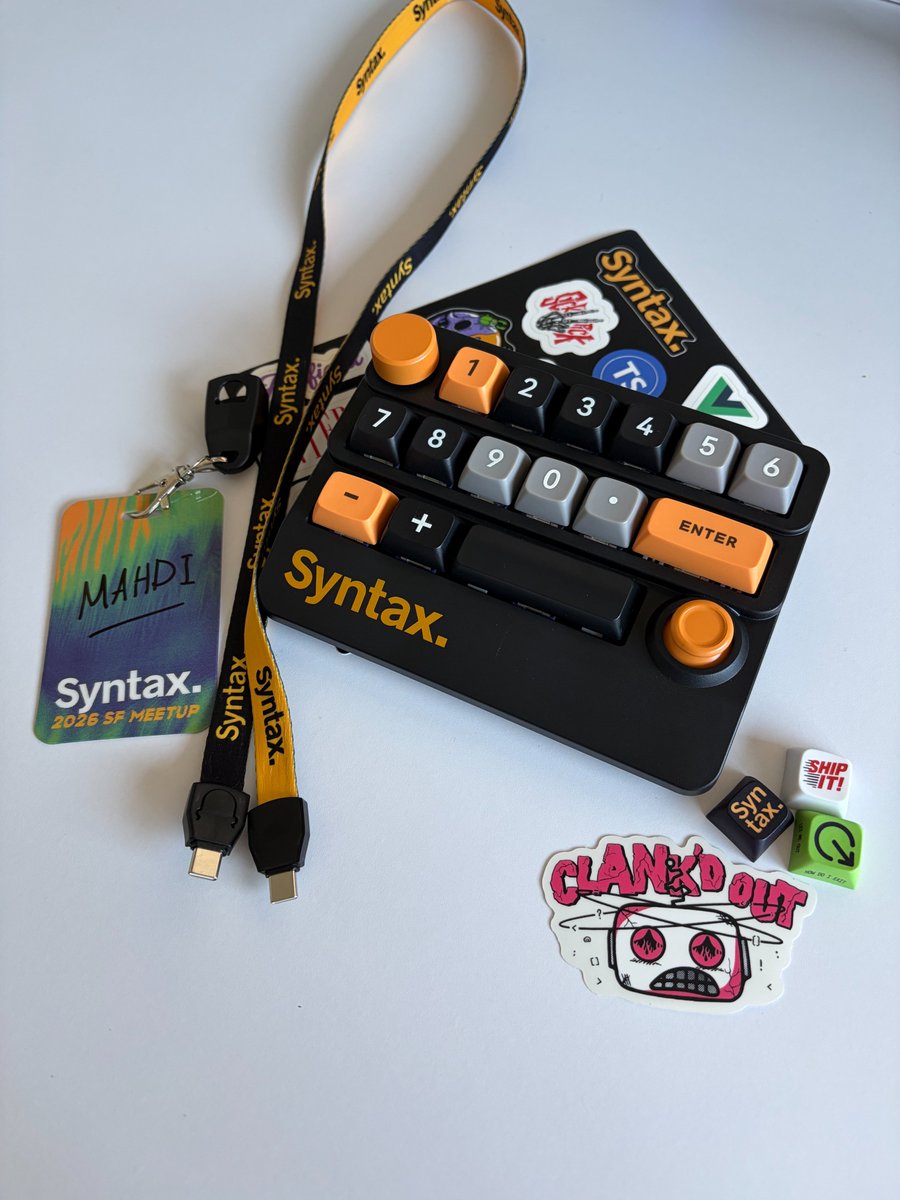 mahdif's tweet photo. Peak Syntax attention to detail: a custom macro pad with swappable keycaps, and lanyards made of USB-C cables https://t.co/NRWZ1BZiQO