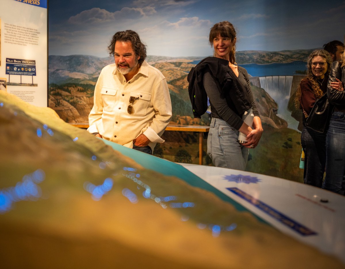 longnow's tweet photo. In the 01940s, the Reber Plan proposed damming San Francisco Bay to turn it into two vast freshwater lakes. The Army Corps of Engineers built the Bay Model in 01956 to test the effects of the proposal. Before computer modeling, there was only one way to simulate a hydrological system as enormous and complex as the Bay Area: build it. 

The Long Now team recently visited the model, which remained an active research tool until 02000, and got to experience the “miniature” up close (it’s 1.5 acres!). It is housed in a cavernous warehouse on the Sausalito waterfront, and its tides still run on a compressed clock, with a full “day” passing every 15 minutes.

The Reber Plan was ultimately abandoned after the model showed it would completely devastate the ecosystems and estuaries. The Bay Model is a remarkable artifact from an era of slide rules and analog science. A reminder of what it looks like to test our largest decisions with patience before committing future generations to the consequences.

Learn more about this Bay Area hidden gem: https://t.co/gqUL0TkCYh 
Amazing photos thanks to Cayla Sharp
