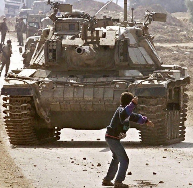 MosabAbuToha's tweet photo. I can hardly imagine anyone who hasn’t seen this photograph. But it was taken on this day in 2000.

I cannot believe the photo is 26 years old now.

The boy in the photograph was Fares Odeh. He was just 14 years old.

Ten days after this image was captured, Fares went out again to throw stones at Israeli tanks, seeking to avenge the killing of his 17-year-old cousin.

An Israeli sniper shot him in the neck, killing him.

And there is another chilling detail to this photograph.

The photo changed Israeli tank doctrine. In August 2001, The Jerusalem Post quoted an anonymous tank doctrinist saying tank personnel were now instructed to fire upon rock-throwers.