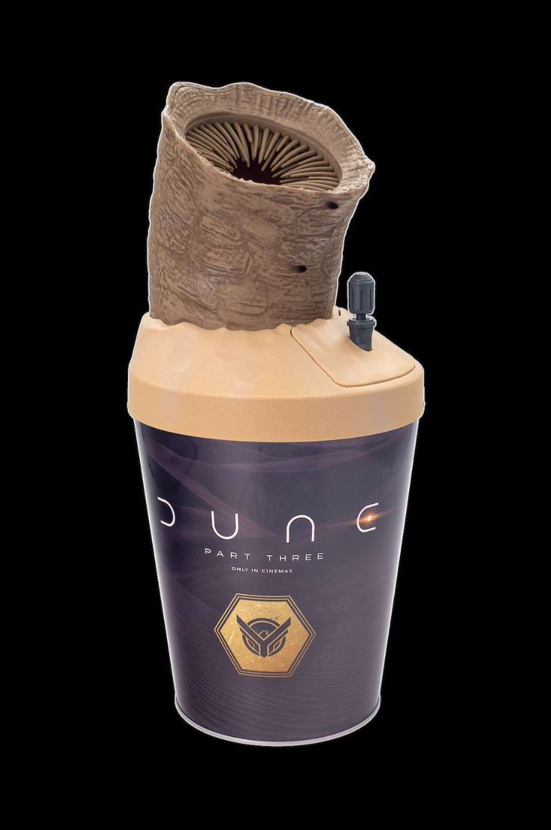 Variety's tweet photo. "Dune 3" popcorn buckets have been revealed by AMC Theatres. 

One of the designs is a “Double Sandworm” collectable featuring two Shai-Hulud, “making it easier to share” popcorn.

https://t.co/tBSh0nYHiB https://t.co/SBJGEE2gIh