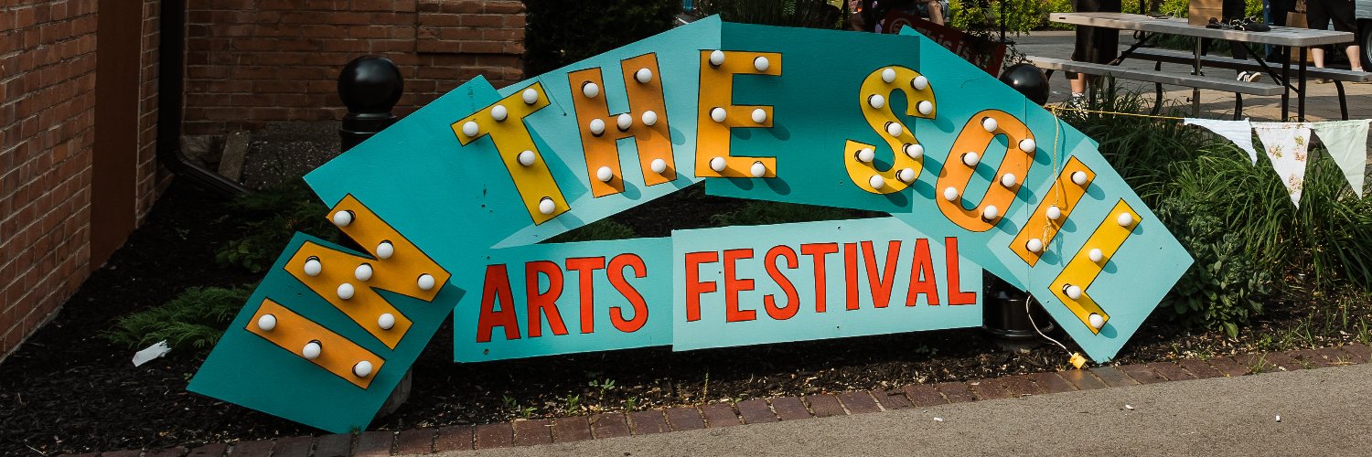 In the Soil Arts Festival banner
