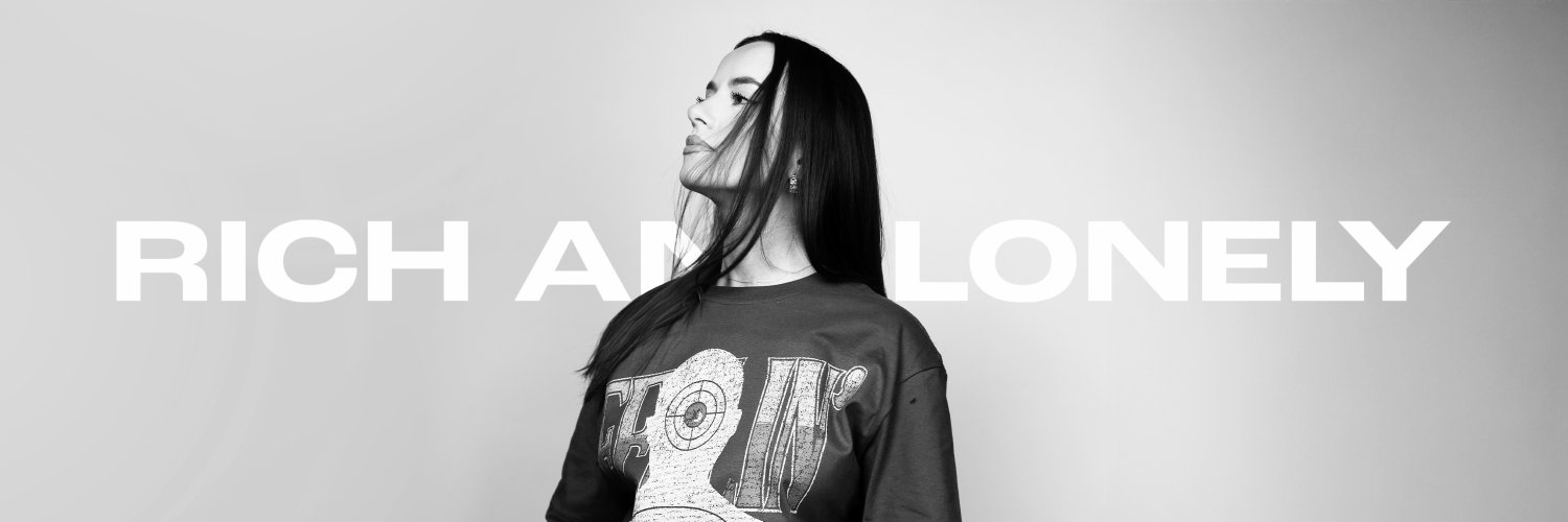 RICH AND LONELY banner