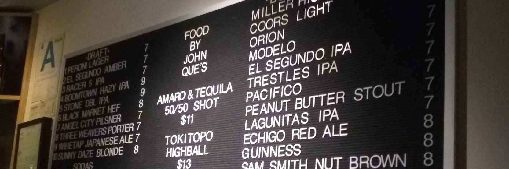 John Que's Smokeout banner