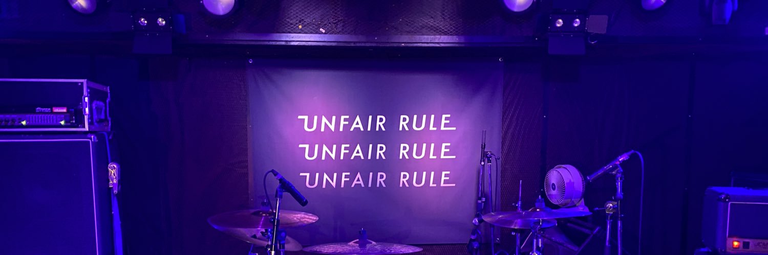 UNFAIR RULE's banner