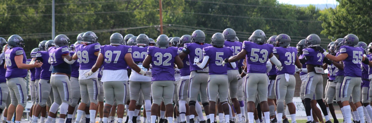 NMHU Football's banner