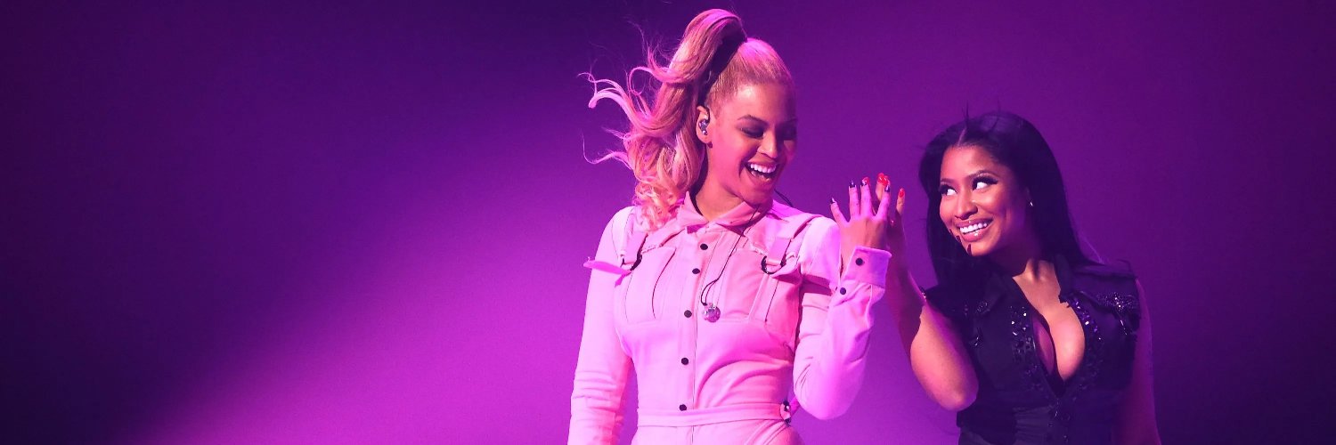 queen of rap slaying with queen bey banner