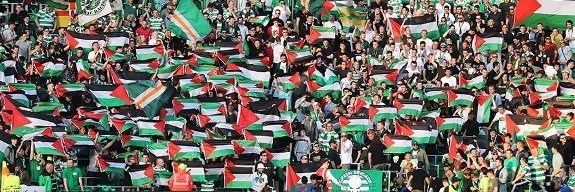 "Solidarity is a verb" banner