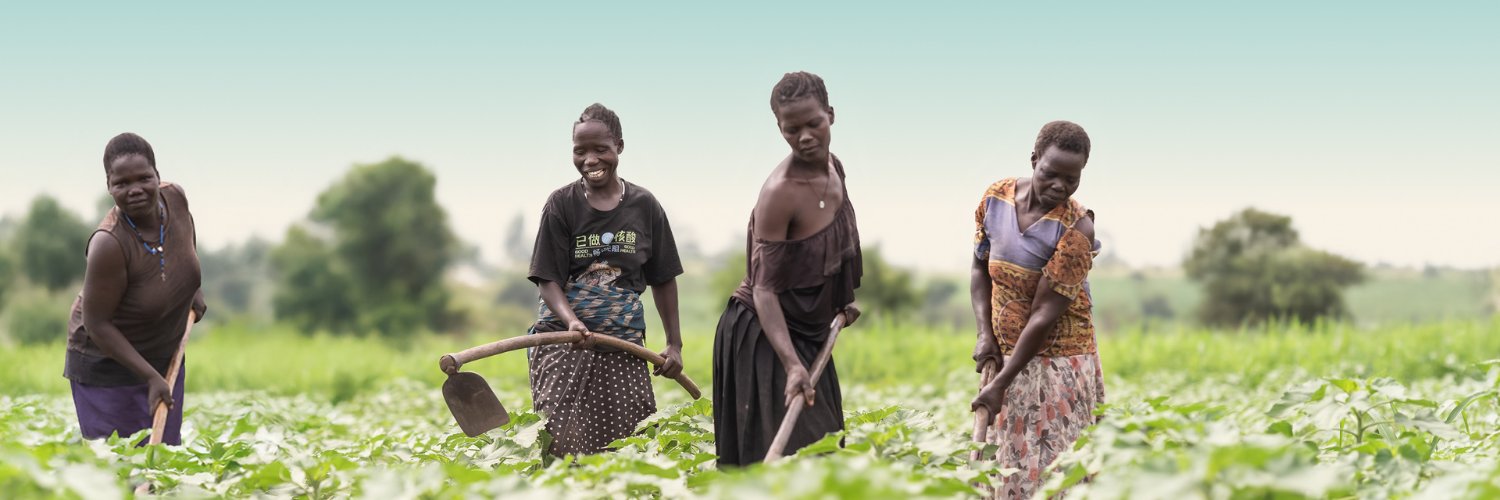 Raising The Village banner