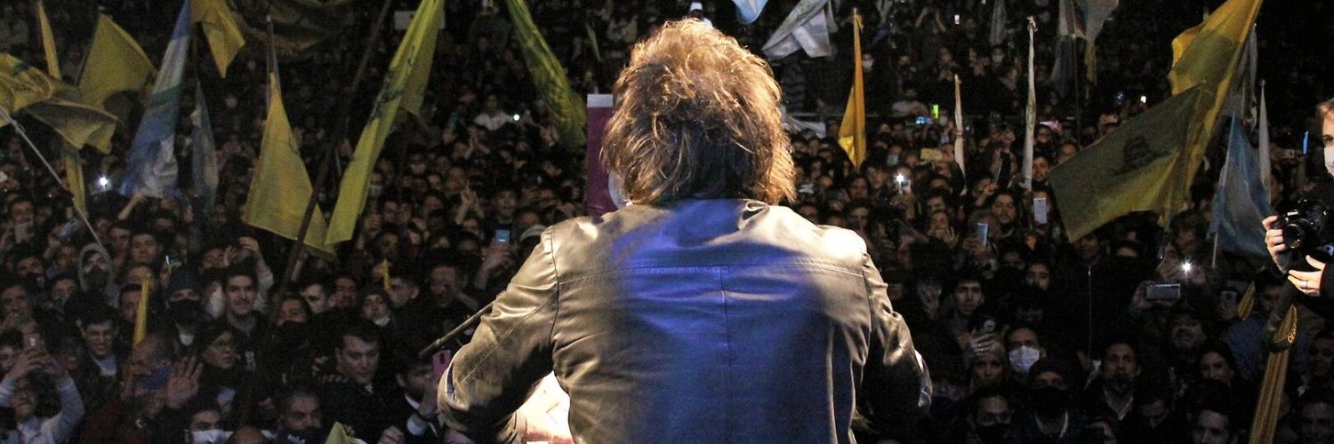 In Milei We Trust's banner