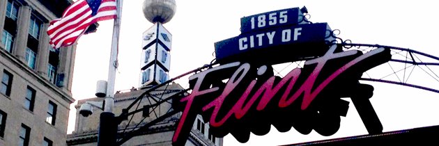 Flint's Club 93.7 banner