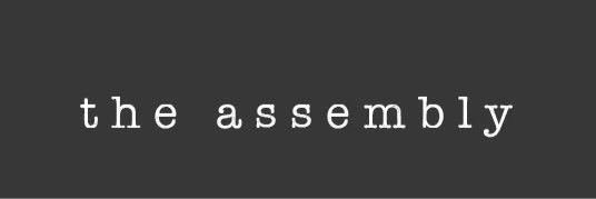 The Assembly banner