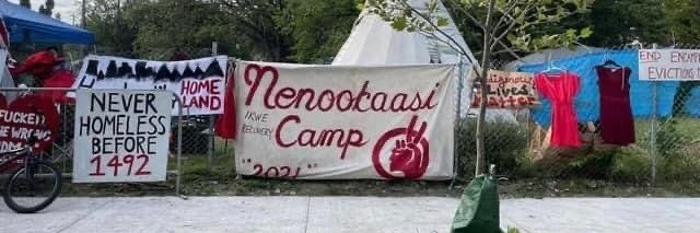 Camp Nenookaasi's banner