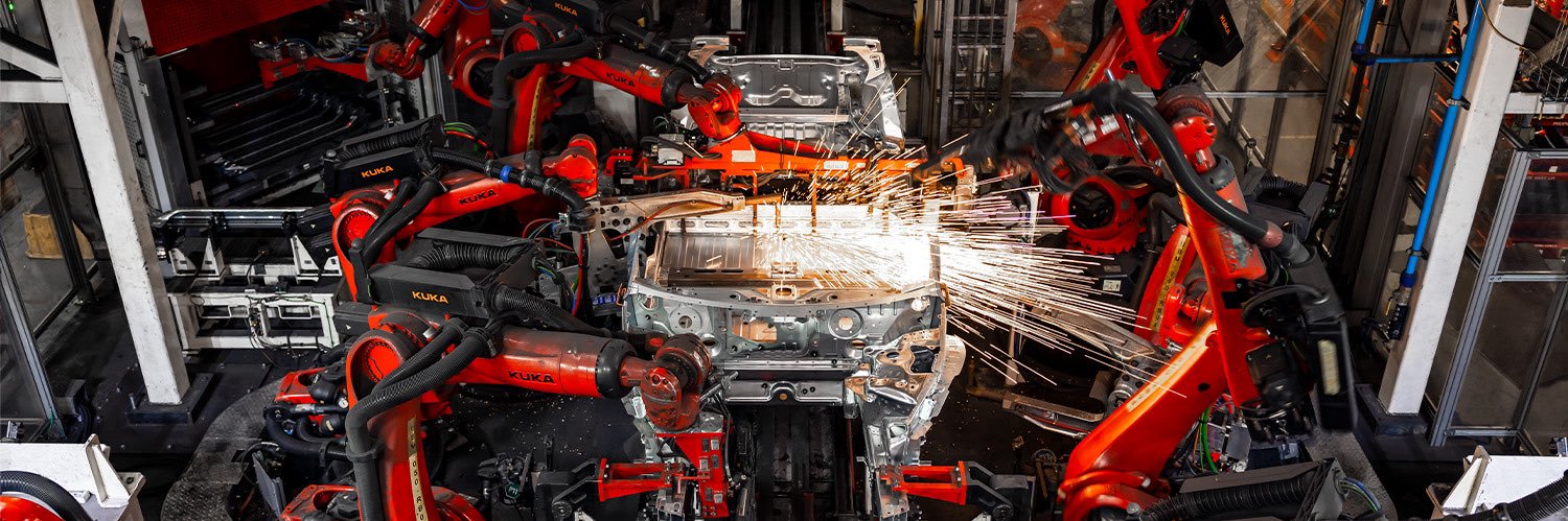 Tesla Manufacturing's banner