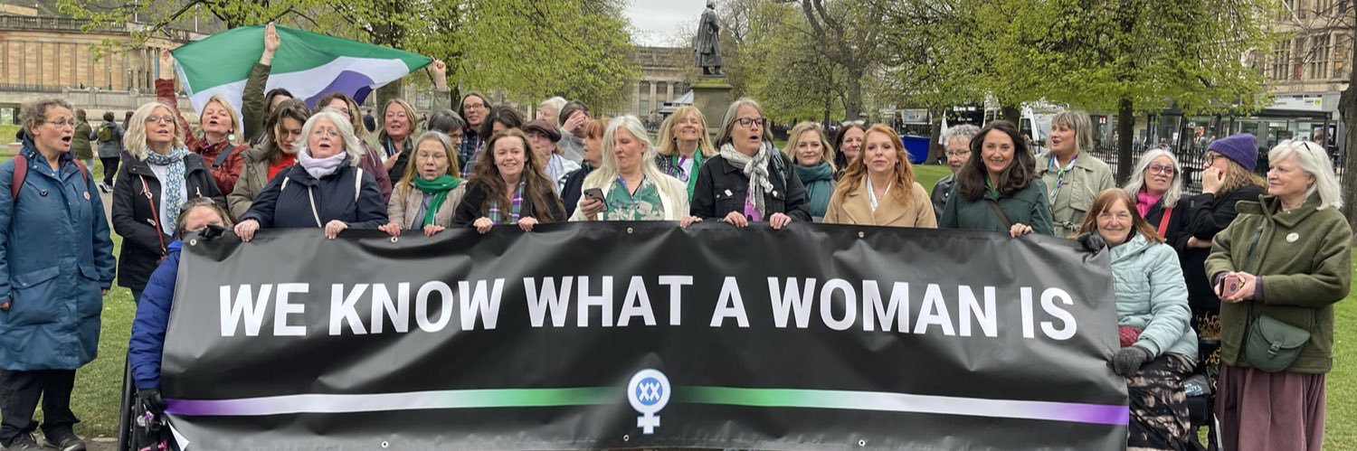 Womaning womanfully's banner