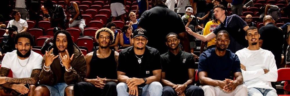 Jermey with the Braids's banner