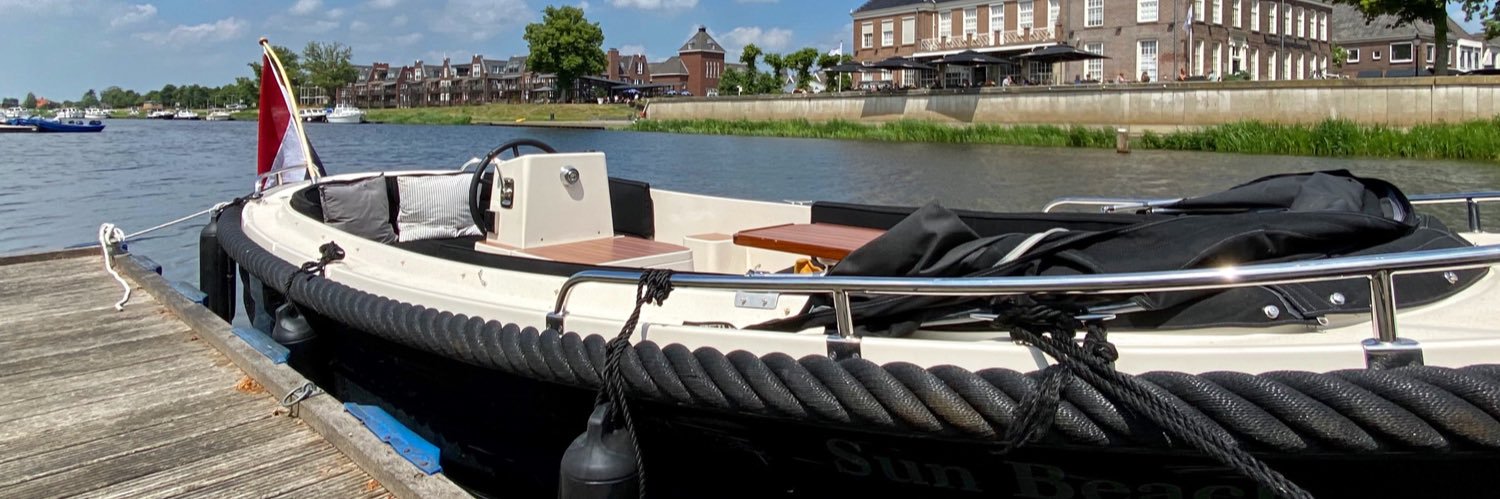 De Zon banner