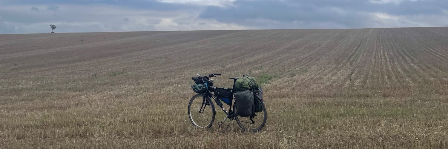 Dev is Cycling the World banner