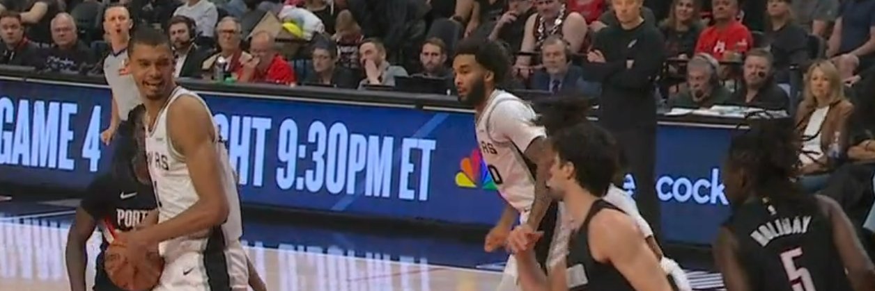 Carter Bryant with the Braids banner