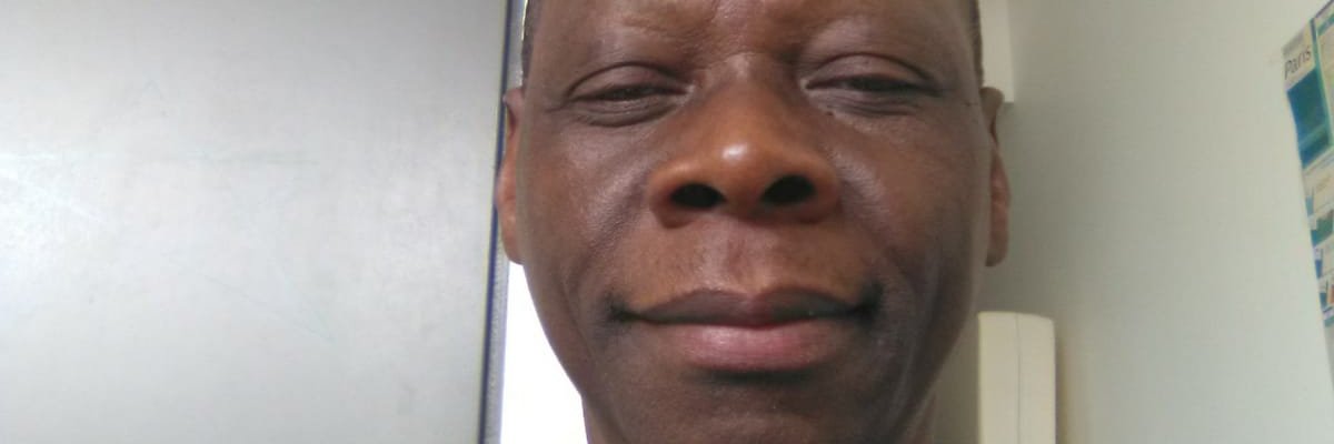 Moukiama Célestin, banner