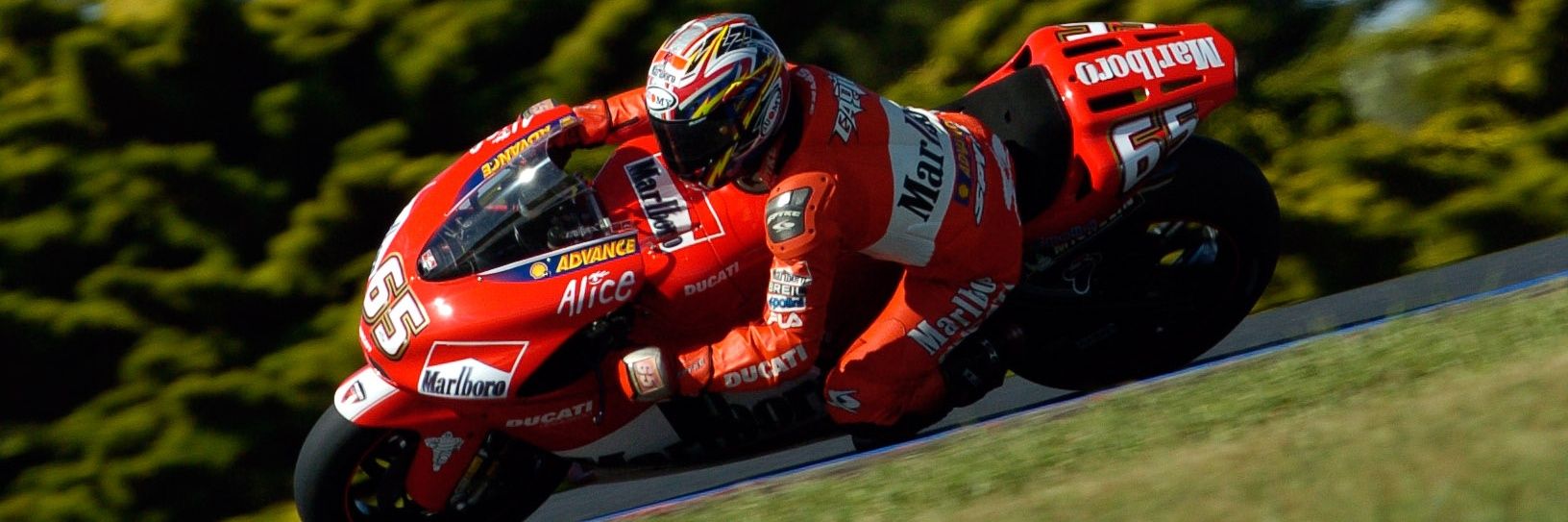 Capirossi 65 Tribute banner