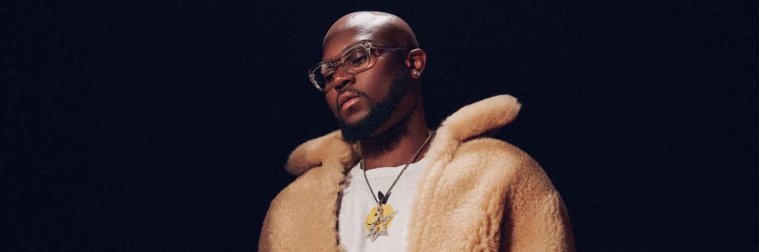 King Promise's banner