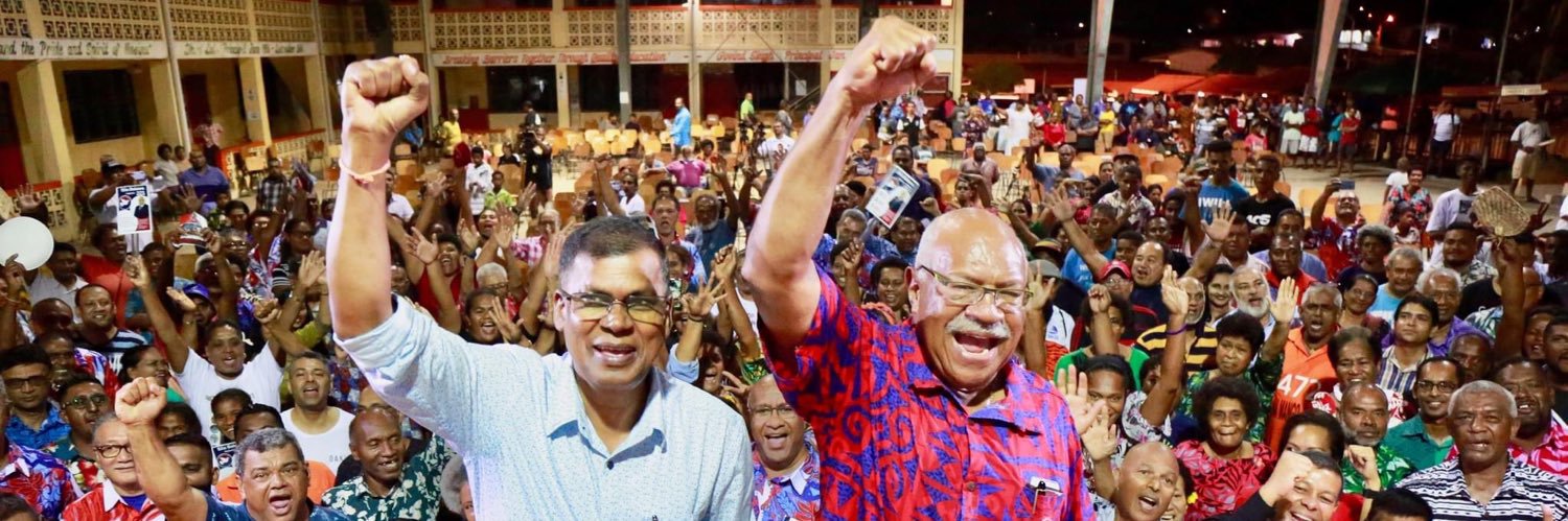 Professor Biman Prasad DPM, Fiji's banner