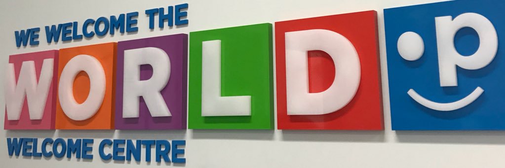 We Welcome the World banner