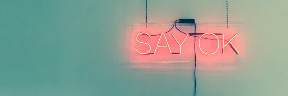 The Say OK banner